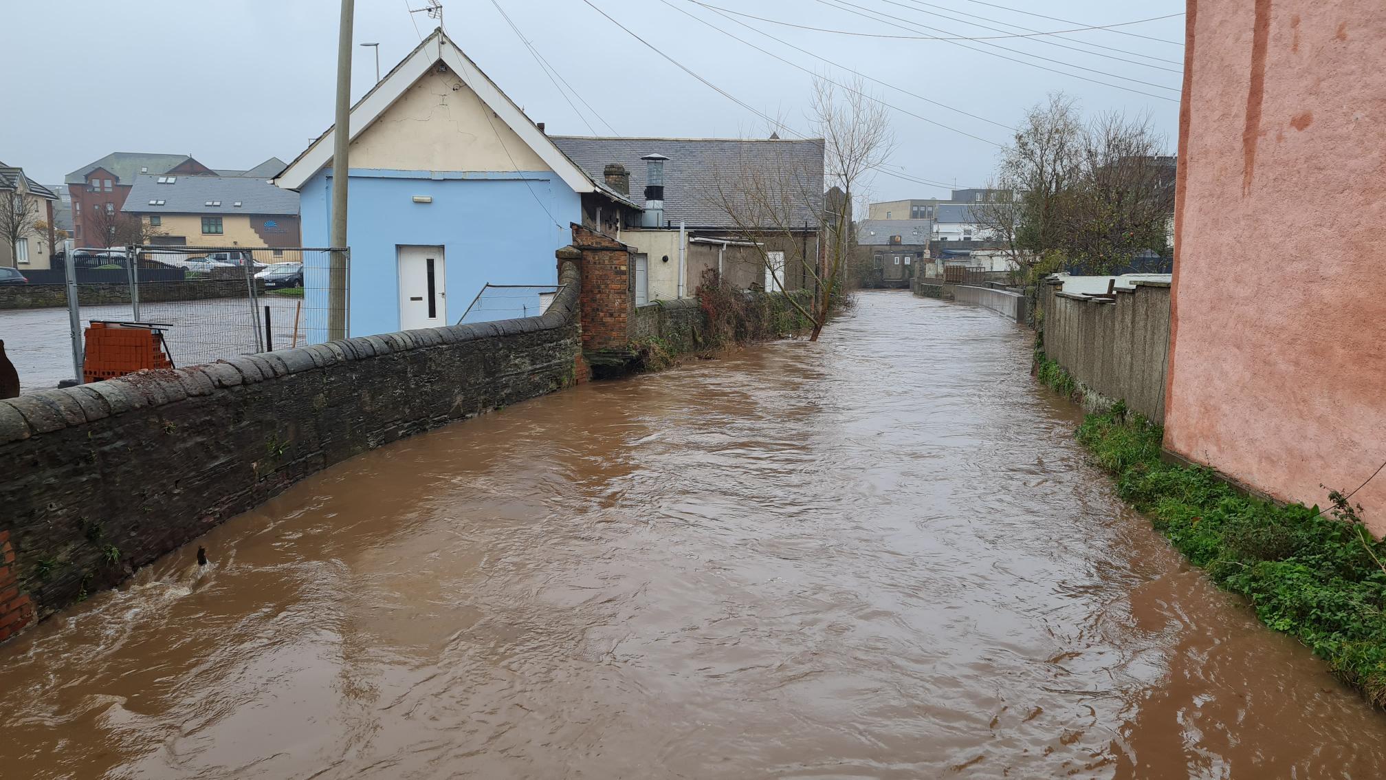 The Brothock Water in town near the harbour. Water levels are high but well contained due to large volumes being stored upstream in the FSAs. Credit: Angus Council